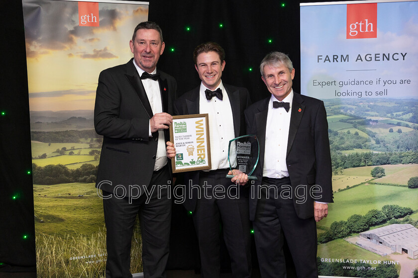 AWA 079 
 South West Farmer awards night 2023 at the Somerset County Cricket Club, Taunton. Pictured Dairy farmer of the year Sponsor Mole Valley's Ian Rolinson with Simon and John Martin, Nunton Farm.