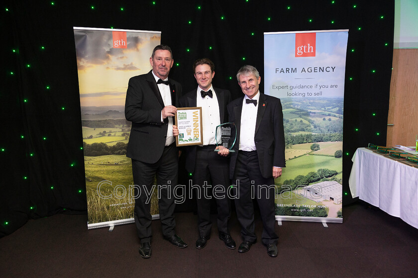 AWA 081 
 South West Farmer awards night 2023 at the Somerset County Cricket Club, Taunton. Pictured Dairy farmer of the year Sponsor Mole Valley's Ian Rolinson with Simon and John Martin, Nunton Farm.