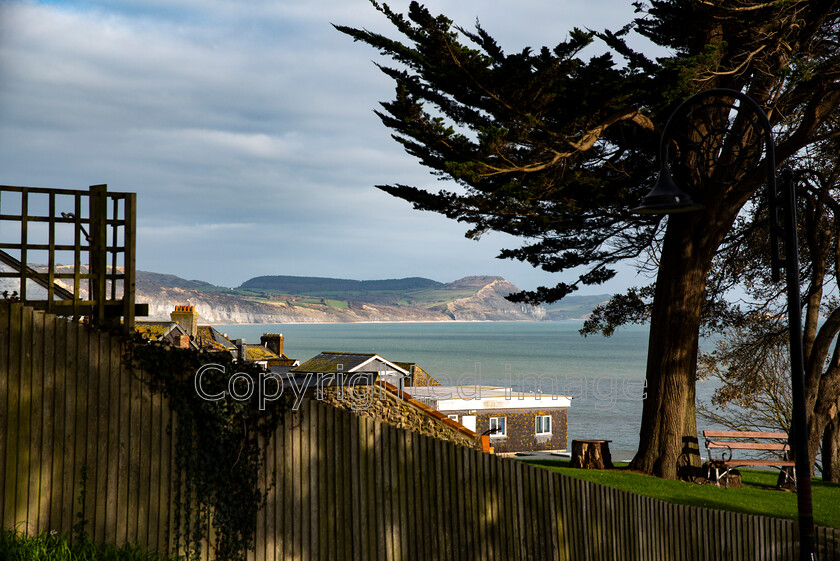 lyme-032 
 Lyme Regis and Uplyme riverside walk 
 Keywords: Lyme Regis, Uplyme, coastal town, Devon, Dorset, boarder, riverwalk, seaside, sea view, gardens, coastal view, sea, blue sea, blue sky, clouds, calm, moody.