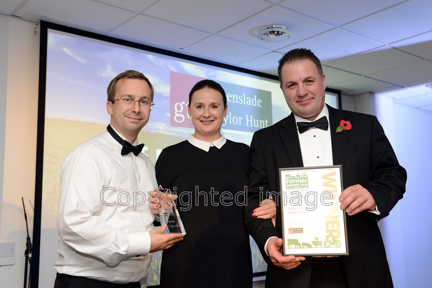 famer-awards20181108 108 
 The South West Farmer Awards 2018. Pictured Tom Mellor with Winners of Beef farmer of the year 2018 Nigel and Anna Gribble from Uphill Farm